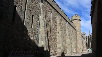 The narrow street of a medieval town. Passage of a medieval castle ...