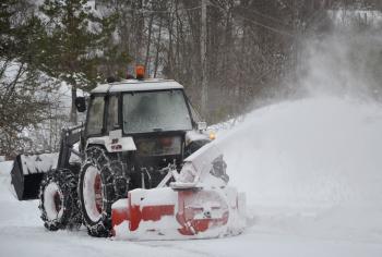 Tractor clearing the snow
