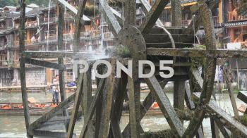 Traditional water wheel generating power in ancient Chinese town ...