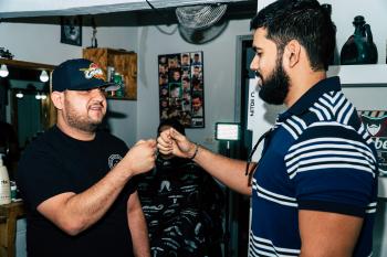 Two Bearded Man Giving Each Other Fist Bump