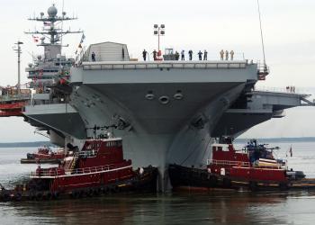 File:US Navy 050830-N-5188B-022 Two tug boats steady the bow of the ...