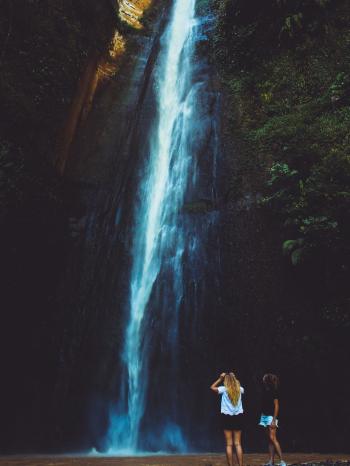 Two Women Near Waterfalls