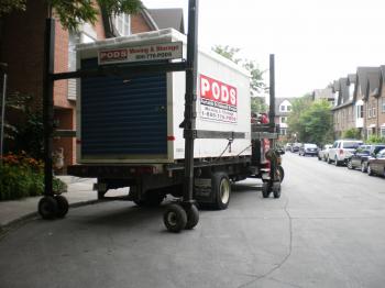 Unloading a shipping container with household contents -c
