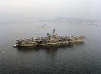 USS KITTY HAWK (CV 63) anchored off the coast of Cannes, France. The guided missile cruiser USS JOSEPHUS DANIELS (CG 27) is in the background.