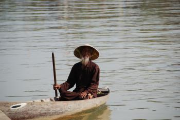 Vietnamese man on a boat