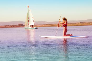 Watersports - Girl Practicing on Paddle Board