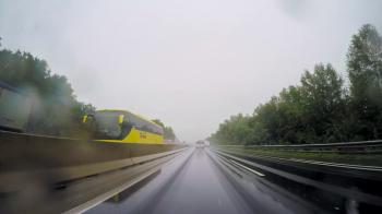 POV vehicle drive on rainy weather, highway lane wet road ...