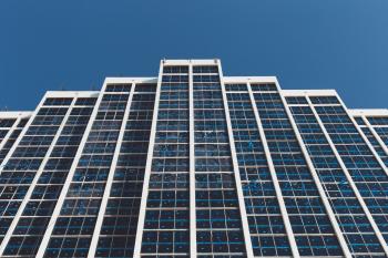 White and Blue High Rise Building Under Blue Sky during Daytime