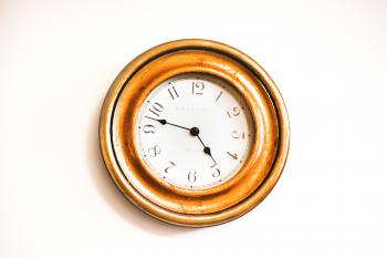 White and Brown Wall Clock Reading at 4:48