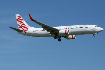 White and Red Virgin Australia Airplane Mid Air Under Blue and White Sky during Daytime