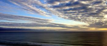 White Sky Under Blue Sea during Dawn
