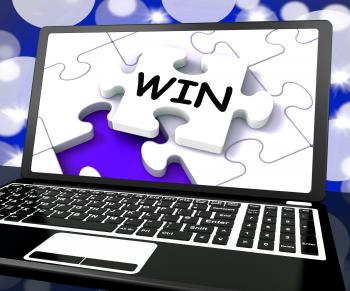 Win Puzzle On Laptop Shows Victory