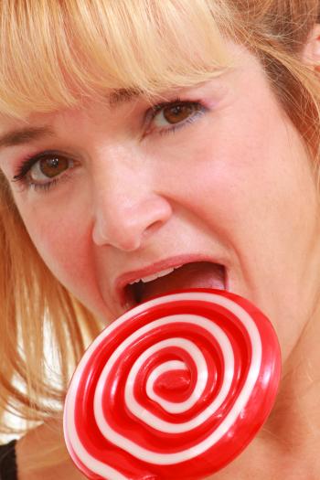 Woman enjoying a lollipop