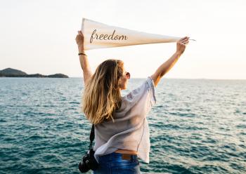 Woman Holding Beige Freedom Printed Banner