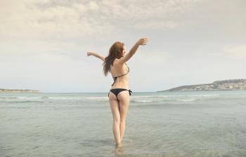 Woman in Black Bikini Standing on Shore