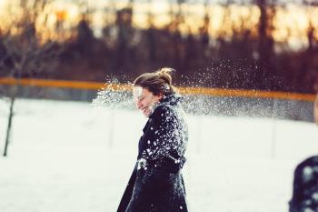 Woman In Black Coat Hit With Snowball On The Head