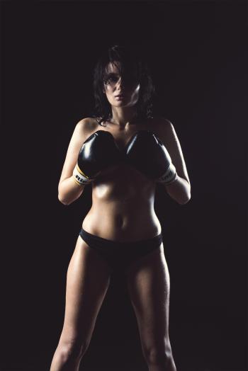 Woman in Black Panty Wearing Black Boxing Gloves Posing for Picture