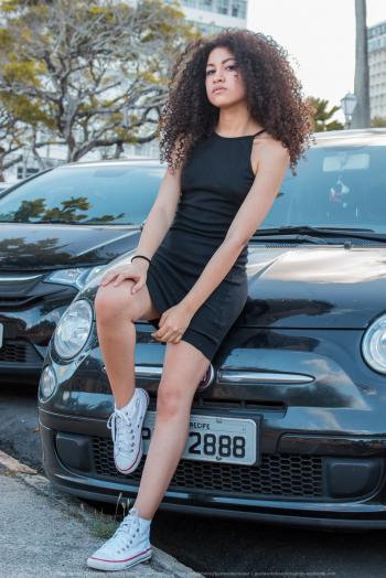 Woman in Black Spaghetti Strap Dress and White Converse All-star High-top