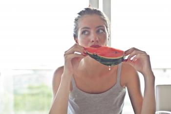 Woman in Gray Tank Top Holding Watermelon