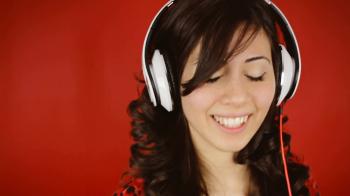 Music woman headphones wink oops. A young beautiful woman dancing ...