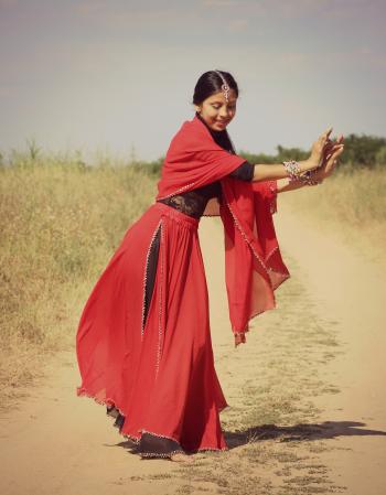 Woman in Red and Black 3/4 Sleeve Dress Dancing