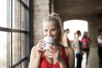 Woman in Red Scoop-neck Tank Top Holding White Mug