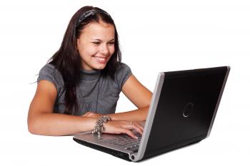 Woman in Turtle Neck Shirt With Grey and Black Laptop Computer