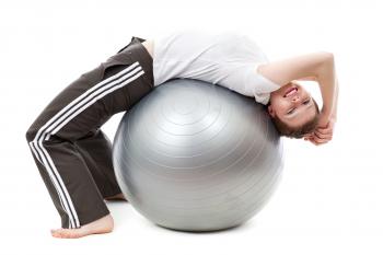 Woman in White Cap Shirt on Stability Ball