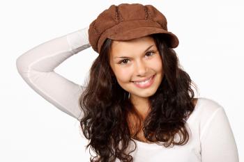 Woman in White Scoop Sleeved Shirt and Brown Cap Smiling