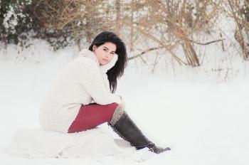 Woman In White Sweater Sitting Near Grass During Winter Season