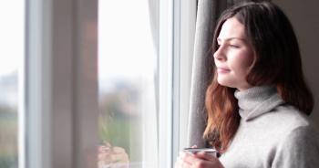 Woman looking out of window with morning coffee Stock Video Footage ...