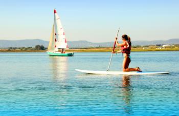 Woman practicing stand-up paddle