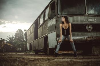 Woman Sitting in Front of Bus