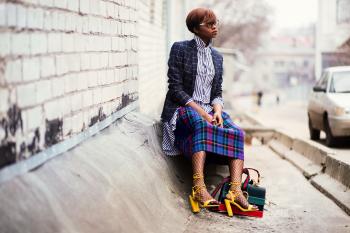 Woman Sitting of Concrete Stair Near Gray Car