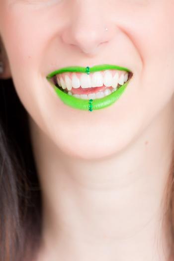 Woman Smiling With Green Lipstick
