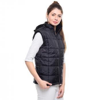 Woman Standing Wearing Black Bubble Zip Turtleneck Vest