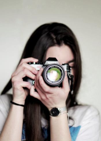 Woman Taking a Photo Using Dslr Camera