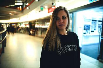 Woman Wearing Black Supreme Sweater