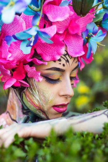 Woman Wearing Pink Petaled Flower Head Dress