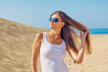Woman Wearing Sunglasses at Beach