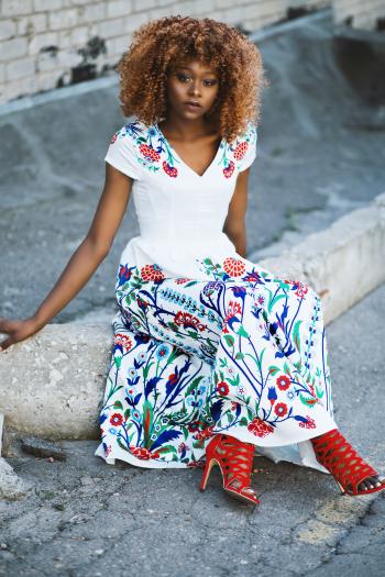 Woman Wearing White and Multicolored Floral V-neck Maxi Dress