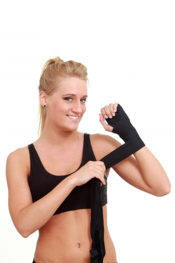 Woman wrapping her hands for a wrestling