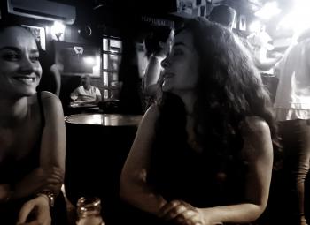 Women at a Bar Talking and Smiling - Retro - Dark Fuzzy Looks
