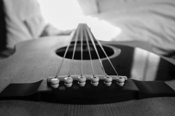Wooden Acoustic Guitar Macro Photography in Grayscale Photo