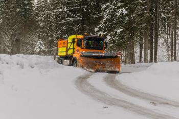 Yellow, Orange, and Black Truck Plowing Snow