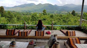 Yoga in Restaurant overviewing beautiful landscape