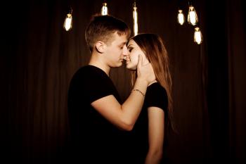 Young Couple Kissing at Night