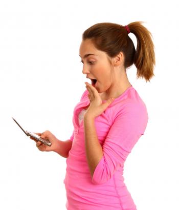 Young girl texting on a cell phone