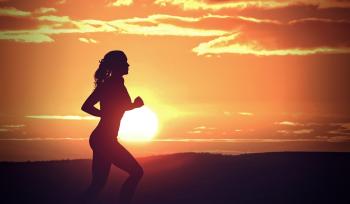 Young Woman Jogging at Sunset