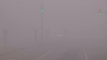 Heavy fog in with zero visibility at city intersection Stock Video ...